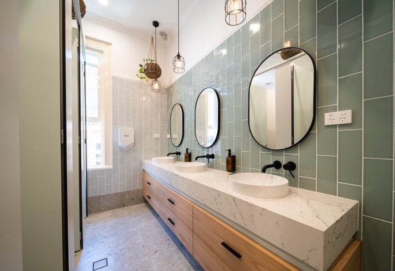 Bathroom renovation with cage pendant lights
