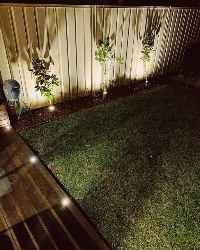 Garden uplighting and deck lights at night