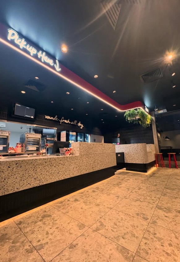 Restaurant service counter with feature and downlighting