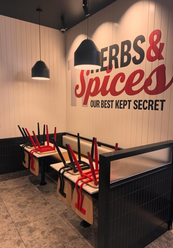 Restaurant dining booths with black pendant lights