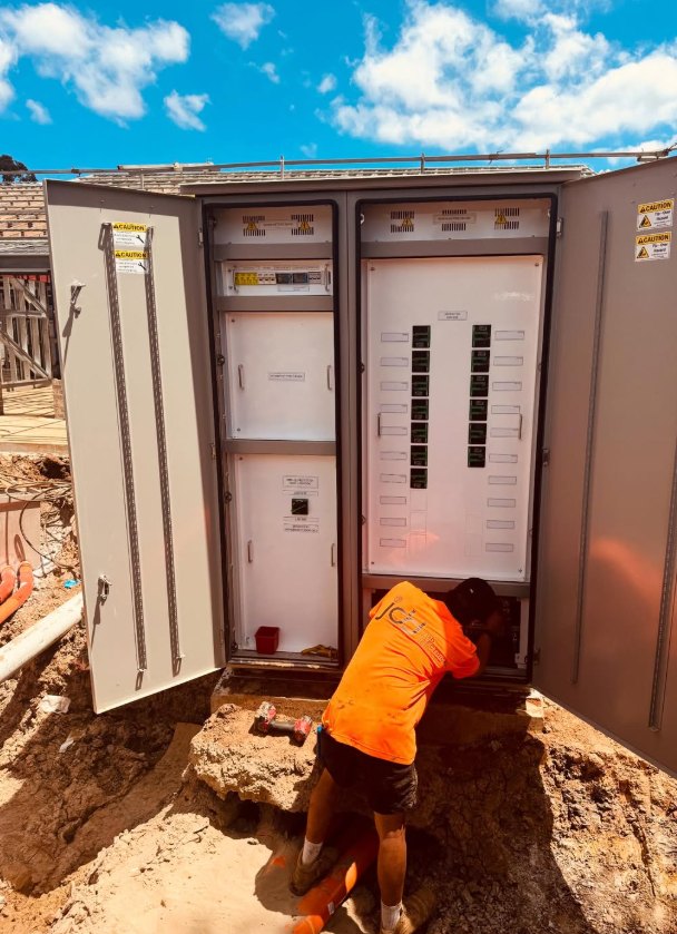 JDD electrician working at a new site switchboard